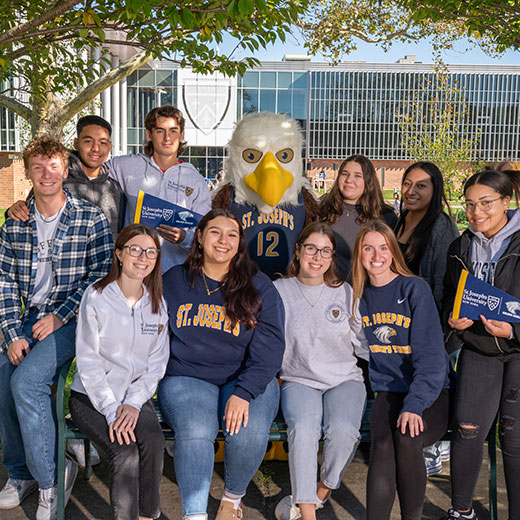 A group of students smiling with the school mascot. Links to Gifts by Will A group of students smiling with the school mascot. Links to Gifts by Will