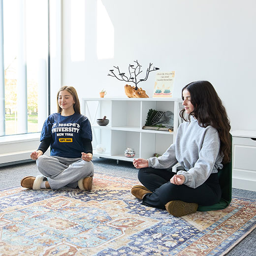 Students meditating in their dorm. Links to Gifts of Life Insurance Students meditating in their dorm. Links to Gifts of Life Insurance